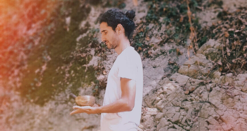 sound healing in nature by the river with a singing bowl